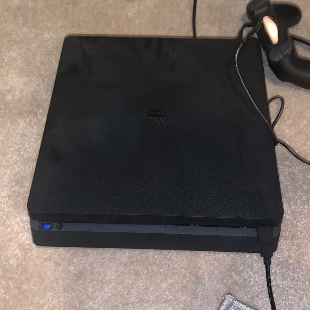PS4 1TB slim console and one game mk11 dual shock one controller.